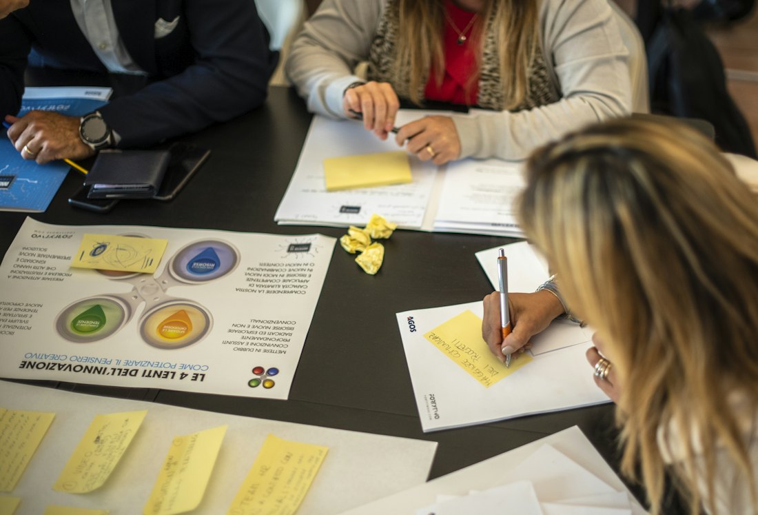 A group around a table, working through papers together